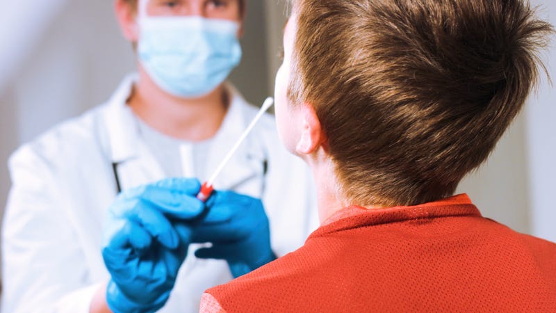 Child getting a COVID-19 vaccine stock photo.