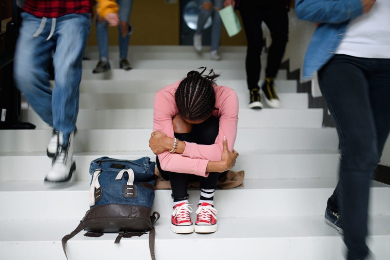 sad teen at school