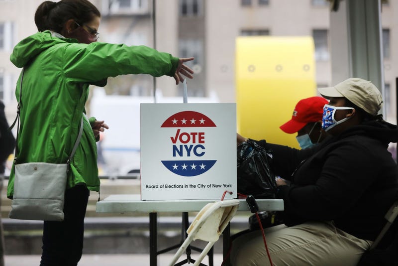 People vote at the Brooklyn Museum during early voting on October 28, 2020 in New York City. Election officials are trying to ensure that the voting process is both safe and efficient due to the coronavirus (COVID-19) pandemic. 