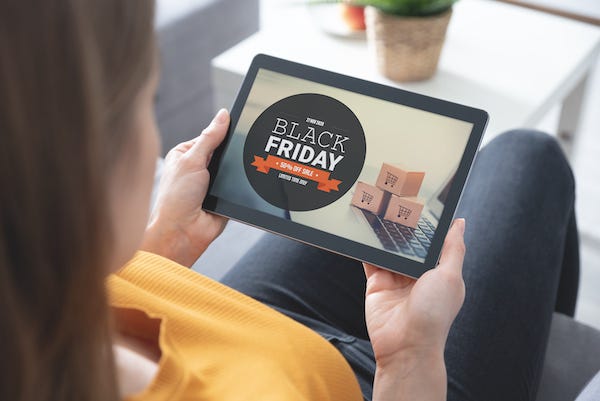 Woman shopping on a tablet during Black Friday