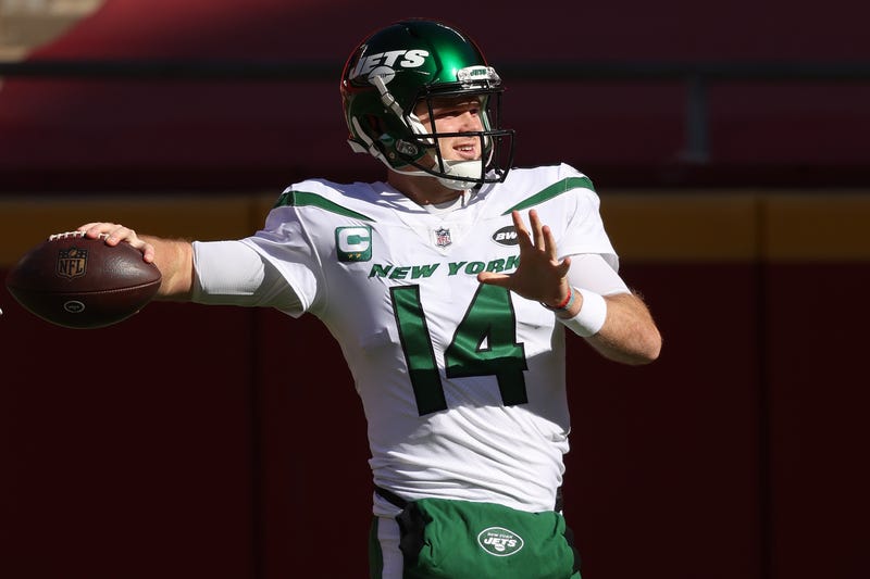 Former Jets quarterback Sam Darnold warming up.