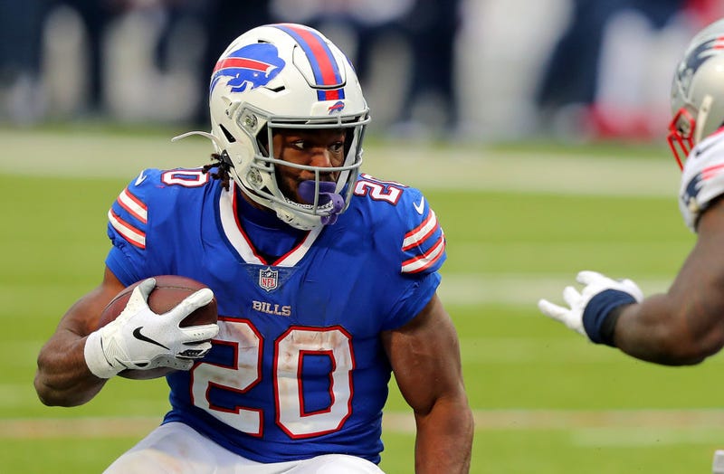 Zack Moss looks for running room against the Patriots.