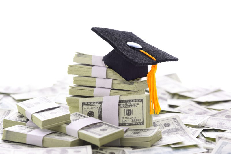 Mortarboard on a pile of money