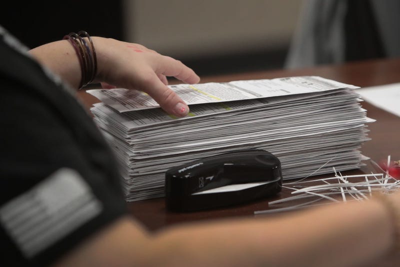 Election officials begin counting absentee ballots at City Hall on November 03, 2020 in Beloit, Wisconsin. 