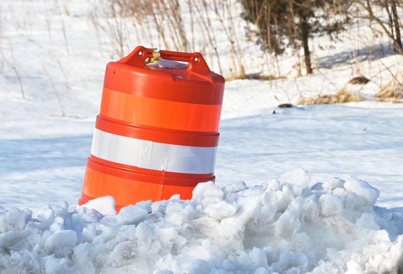 Construction barrel in snow