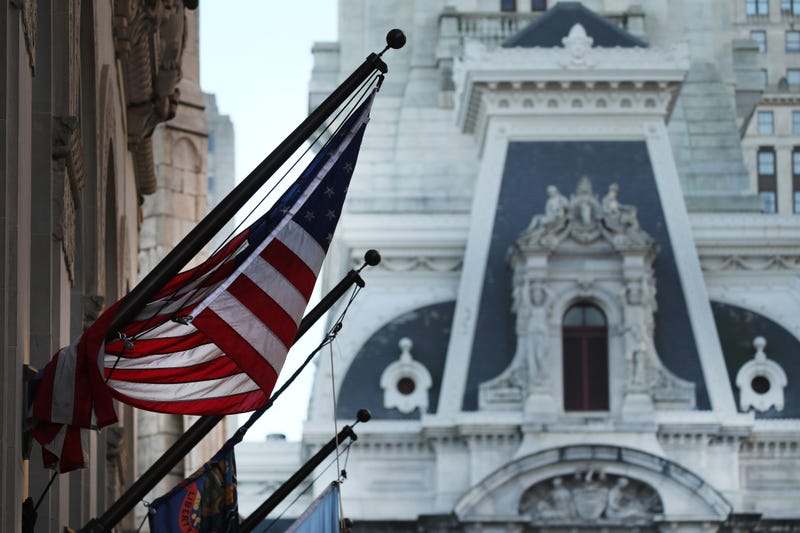 An American Flag hangs from a building in Philadelphia the morning after Americans voted in the presidential election on November 04, 2020 