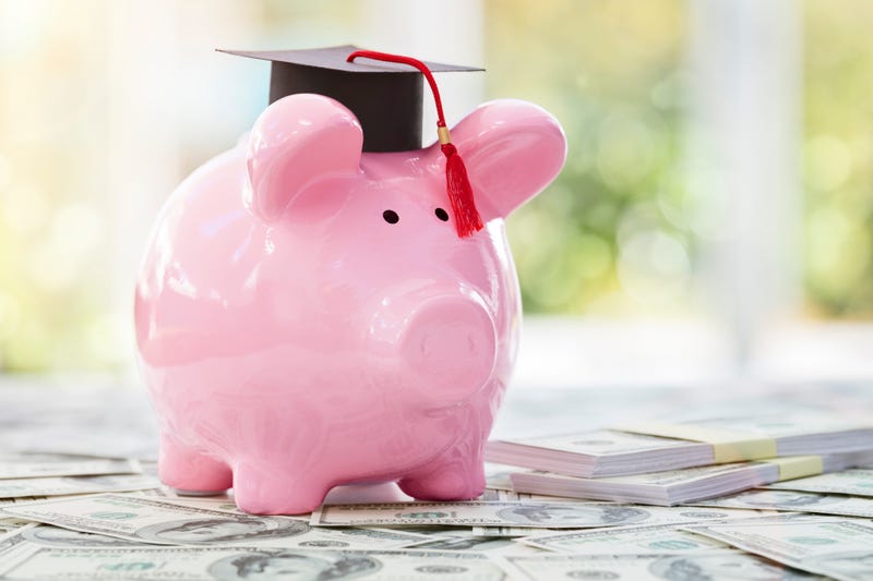 Pink piggy bank with graduation cap