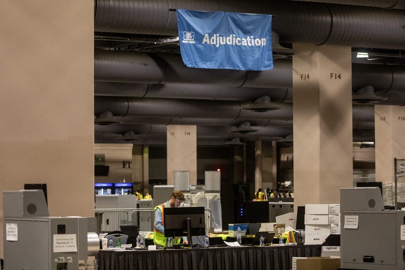 An election worker counting ballots at the Pennsylvania Convention Center in Philadelphia after the 2020 presidential election.