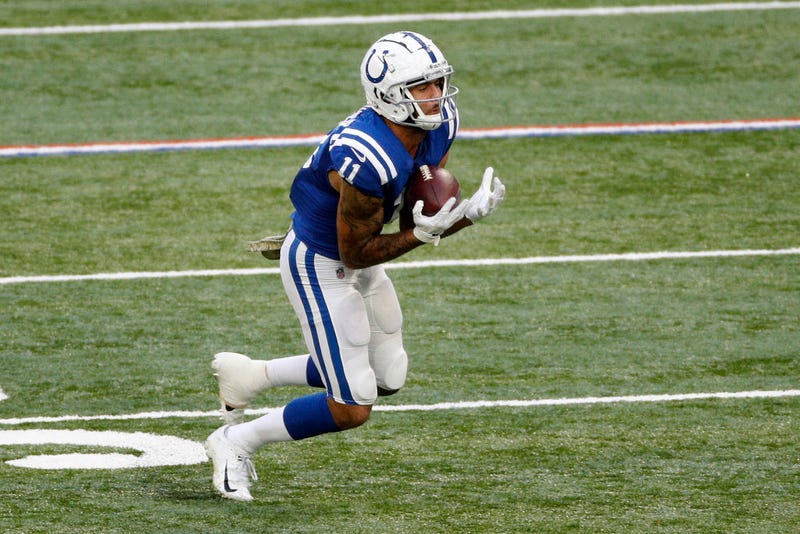 Michael Pittman Jr. looks for running room after receiving a pass.
