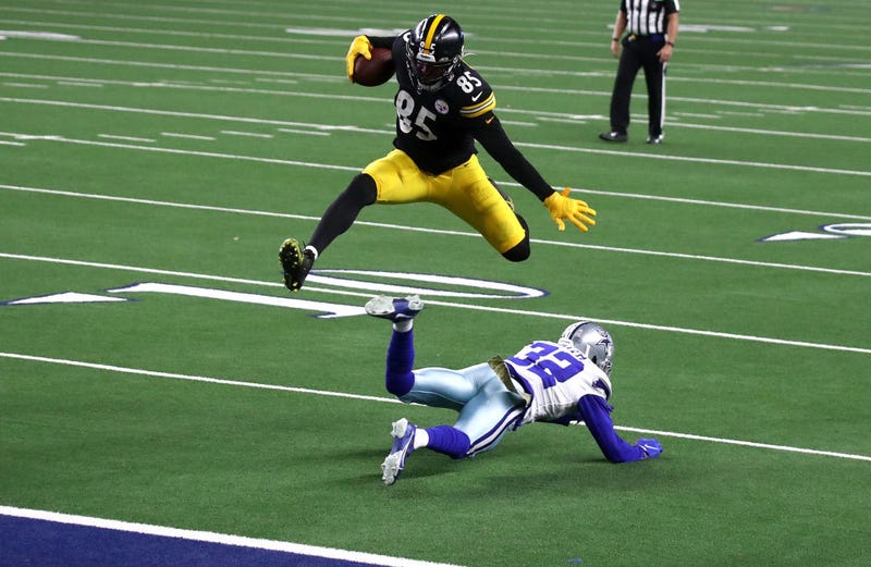Eric Ebron hurdles a Cowboys defender en route to a touchdown in Week 10.