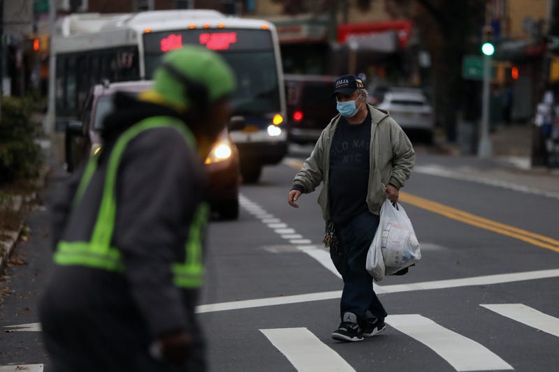 A man walks along a street in Staten Island on November 12, 2020 in New York City