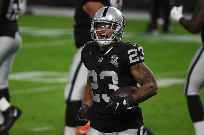 Devontae Booker reacts after scoring a touchdown.