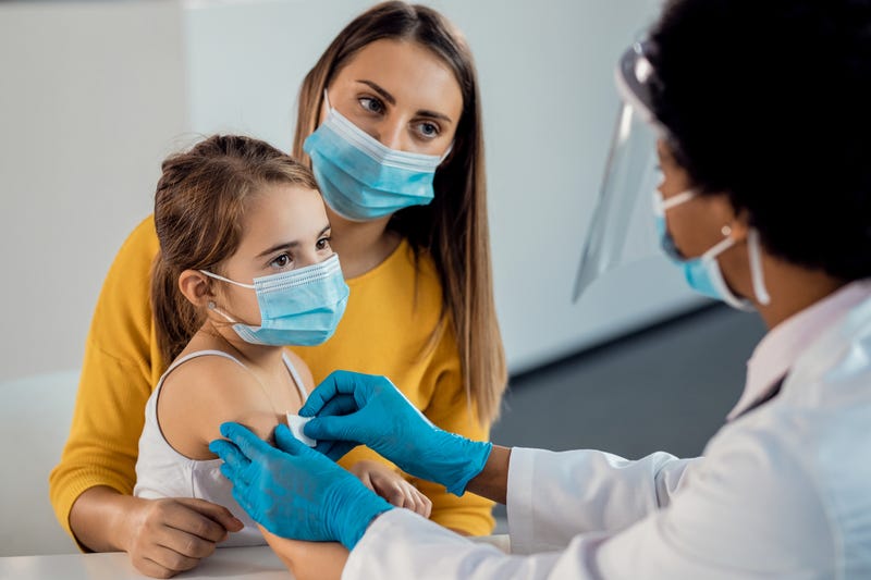 Child getting vaccine stock photo. 