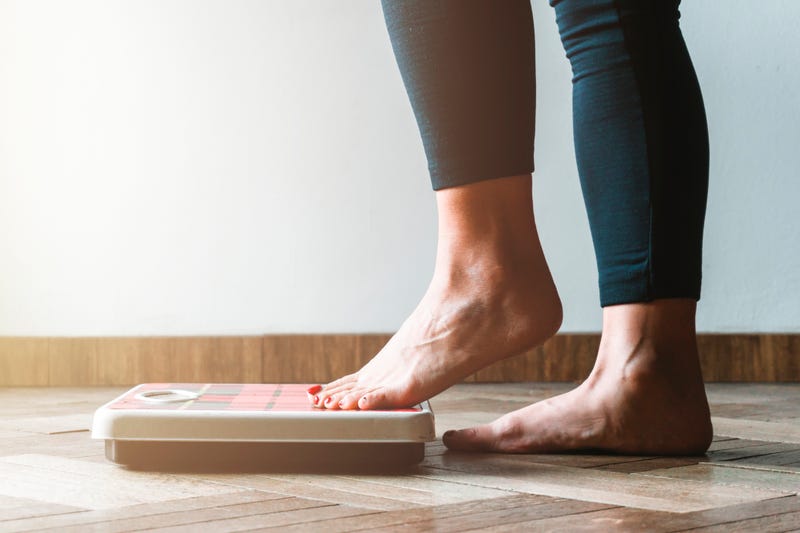 Feet on scale stock photo.