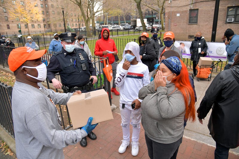 Tracy Morgan (L), Food Bank For New York City, and Council Member Robert E. Cornegy Jr. distribute turkeys to Brooklyn families in celebration of Thanksgiving on November 21, 2020 in Brooklyn, New York. 