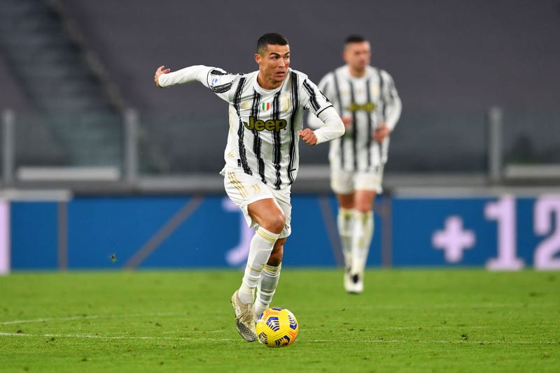 Cristiano Ronaldo of Juventus runs with the ball during the Serie A match between Juventus and Cagliari Calcio at on November 21, 2020 in Turin, Italy. Football Stadiums around Europe remain empty due to the Coronavirus Pandemic as Government social distancing laws prohibit fans inside venues resulting in fixtures being played behind closed doors.