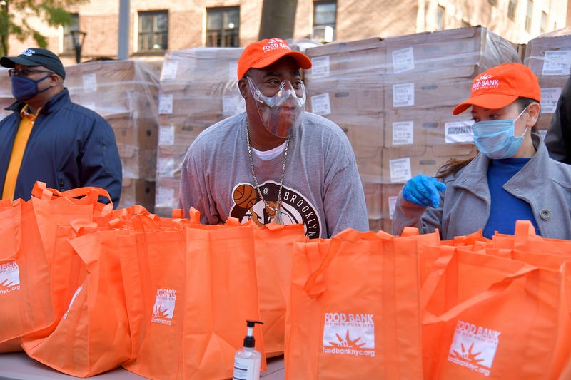 Tracy Morgan (C), Food Bank For New York City, and Council Member Robert E. Cornegy Jr. distribute turkeys to Brooklyn families in celebration of Thanksgiving on November 21, 2020 in Brooklyn, New York. 