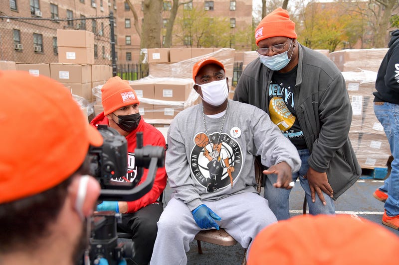 Edgar Berlanga (L) and Tracy Morgan (C) attend as Food Bank For New York City, Tracy Morgan, and Council Member Robert E. Cornegy Jr. distribute turkeys to Brooklyn families in celebration of Thanksgiving on November 21, 2020 in Brooklyn, New York. 