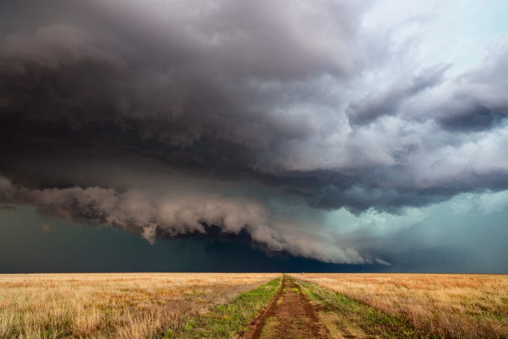 Storm over a dirt road. 