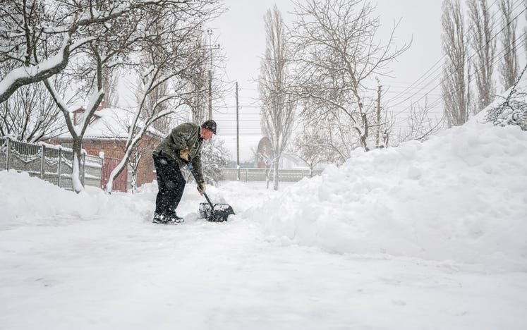 shoveling heavy snow