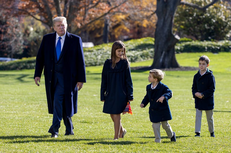 Donald Trump, followed by his grandchildren, Arabella Kushner, Theodore Kushner, and Joseph Kushner walk on the south lawn of the White House on November 29, 2020 in Washington, DC. President Trump spent the weekend at Camp David and at Trump National Golf Club in Sterling, Virginia. 