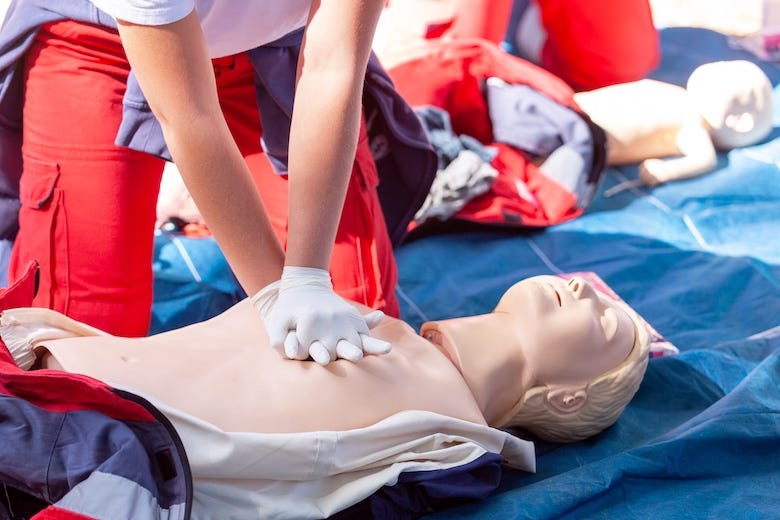 Practicing CPR on a dummy