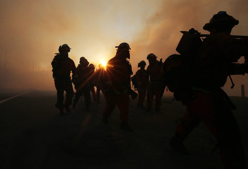 silhouettes of firefighters