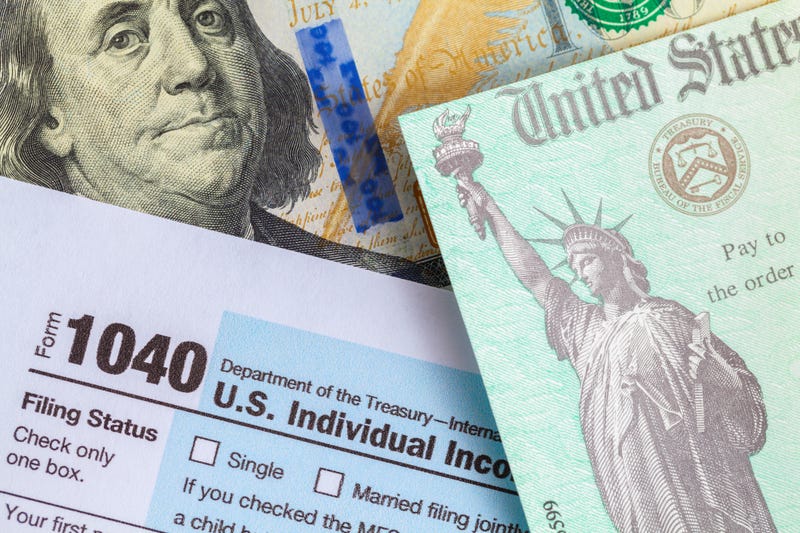 Tax refund check and tax documents.