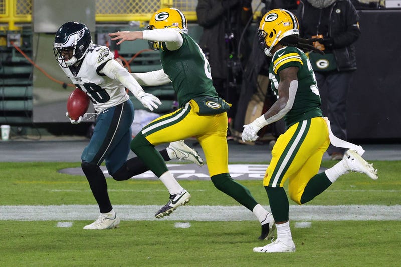 Jalen Hurts returns a punt for a touchdown against the Green Bay Packers