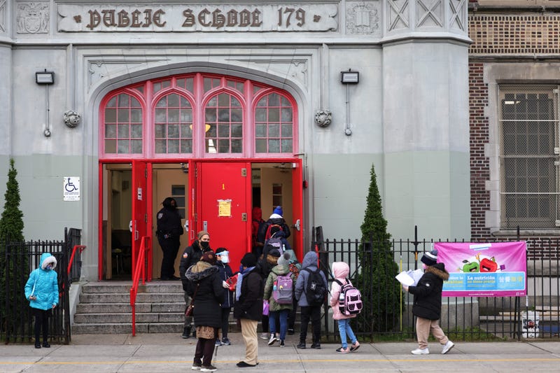Children line up as they enter P.S. 179 Kensington on December 07, 2020