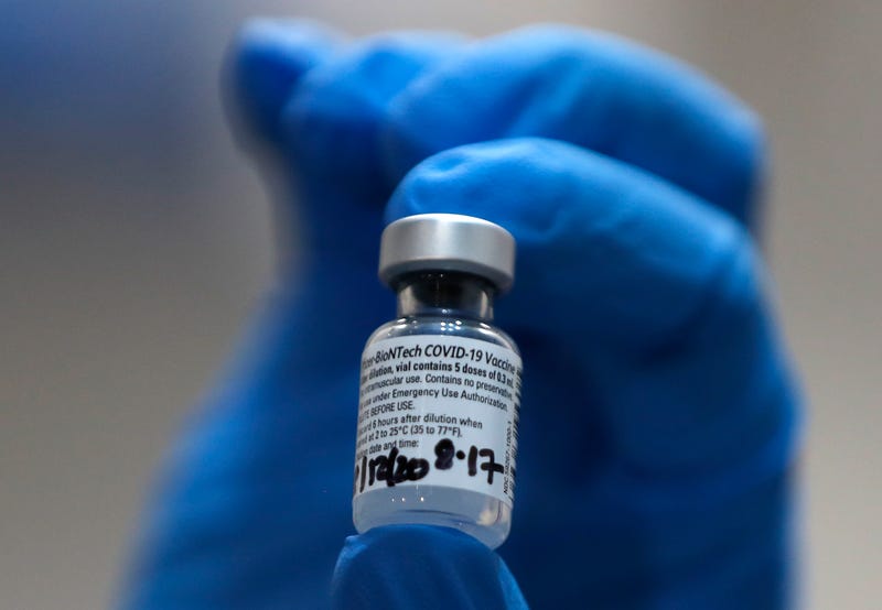 A nurse holds a vial of the Pfizer-BioNTech COVID-19 vaccine at Guy's Hospital on December 8, 2020 in London, United Kingdom.