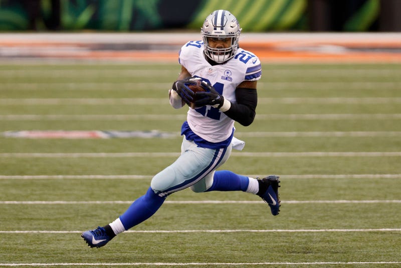 Ezekiel Elliott #21 of the Dallas Cowboys runs with the ball in the second quarter against the Cincinnati Bengals at Paul Brown Stadium on December 13, 2020 in Cincinnati, Ohio.