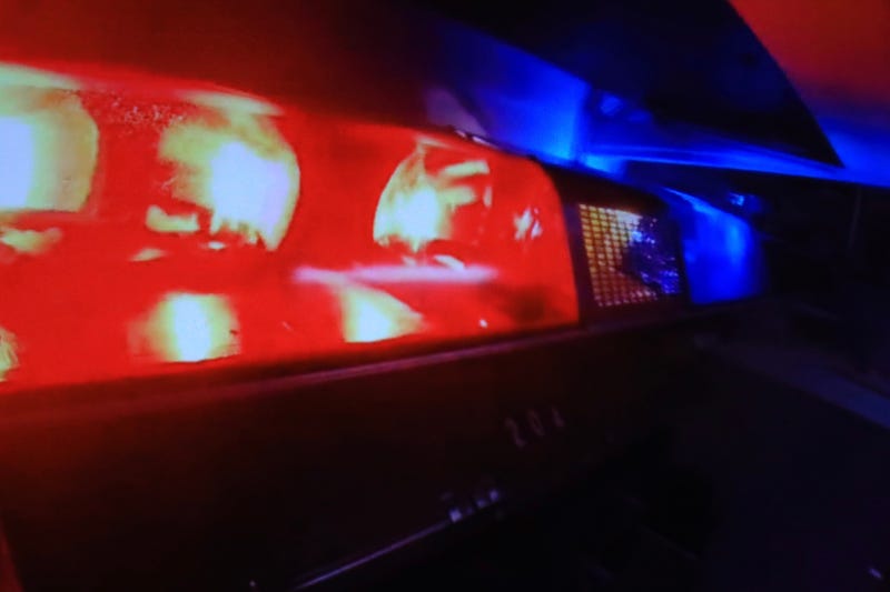 Emergency lights on a police car flashing.