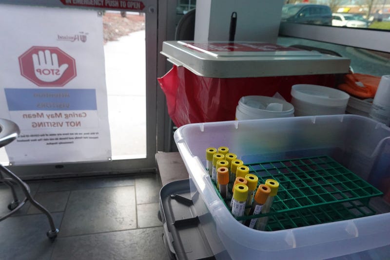 Blood samples are collected to test residents for COVID-19 antibodies at Roseland Community Hospital