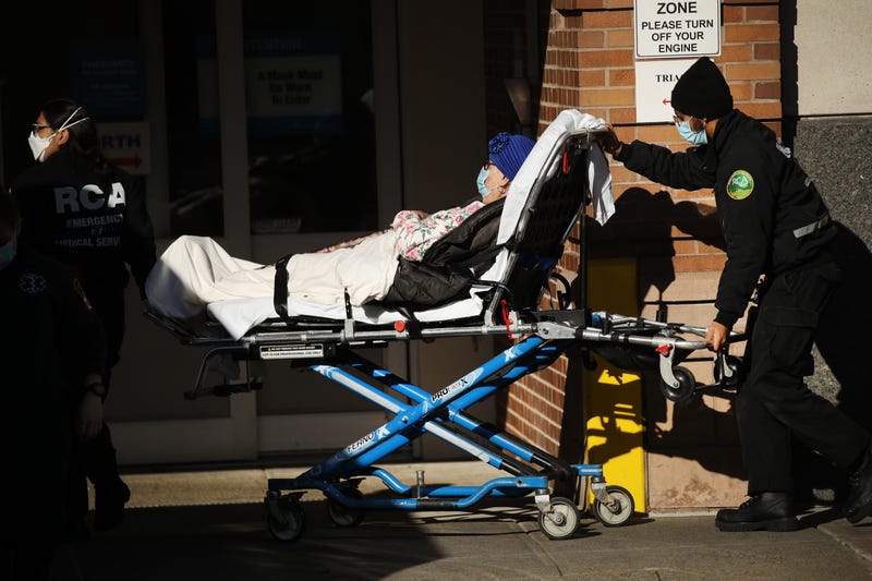 Medical workers tend to a patient at a Brooklyn hospital that has seen a rise in coronavirus-related cases on December 15, 2020 in New York City.