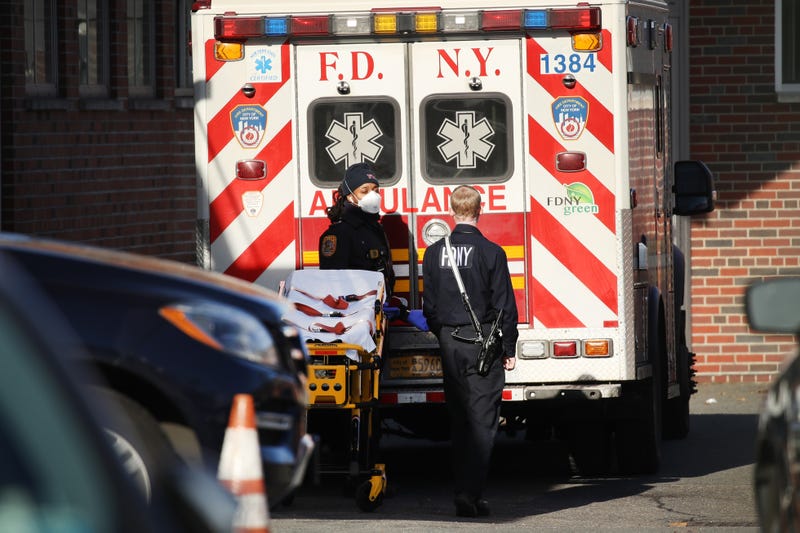 Medical workers tend to a patient at a Brooklyn hospital that has seen a rise in coronavirus-related cases on December 15, 2020 in New York City.