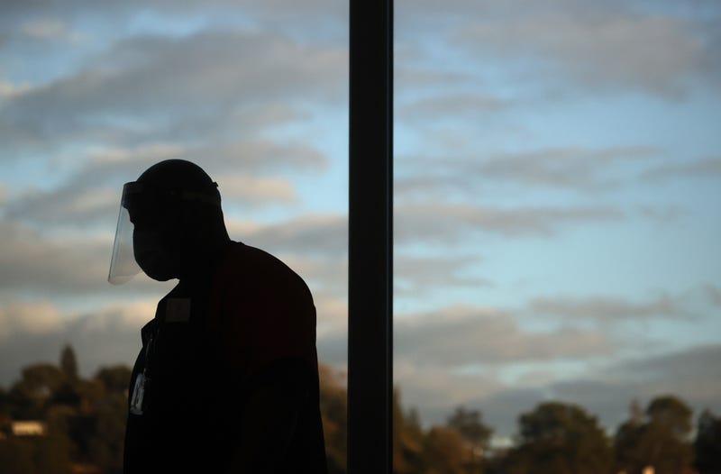 A frontline healthcare worker wears a face shield after receiving a Pfizer COVID-19 vaccination at Contra Costa Regional Medical Center on December 15, 2020 in Martinez, California.