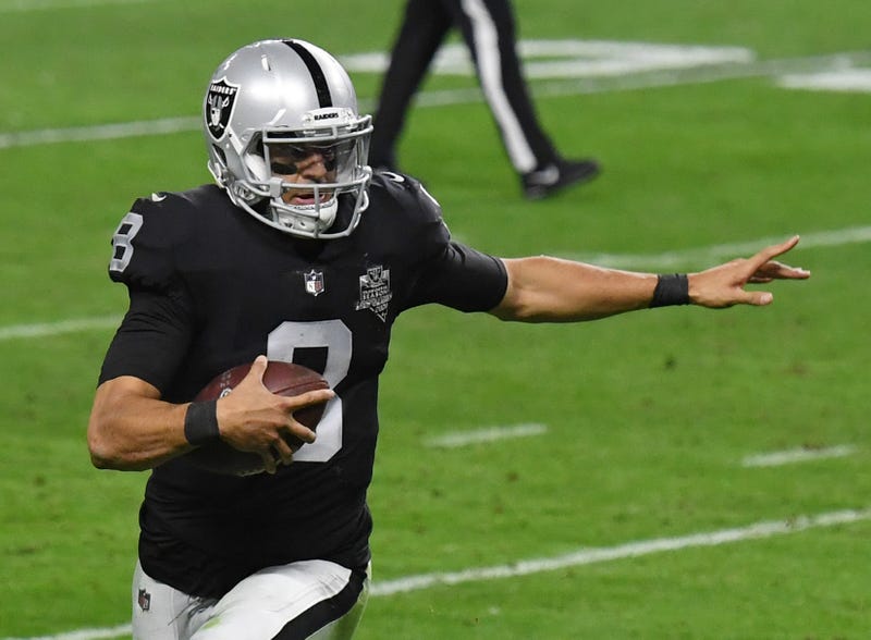 Quarterback Marcus Mariota #8 of the Las Vegas Raiders runs for a 2-yard touchdown against the Los Angeles Chargers in the second half of their game at Allegiant Stadium on December 17, 2020 in Las Vegas, Nevada.