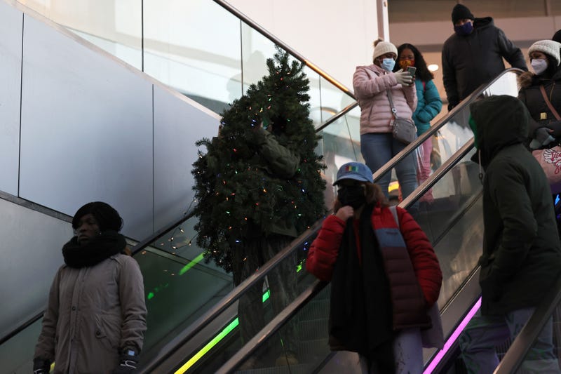 Tommy Liberto rides an escalator in the Staten Island ferry terminalafter arriving in NYC wearing a Christmas tree costume on December 18, 2020 in New York City.