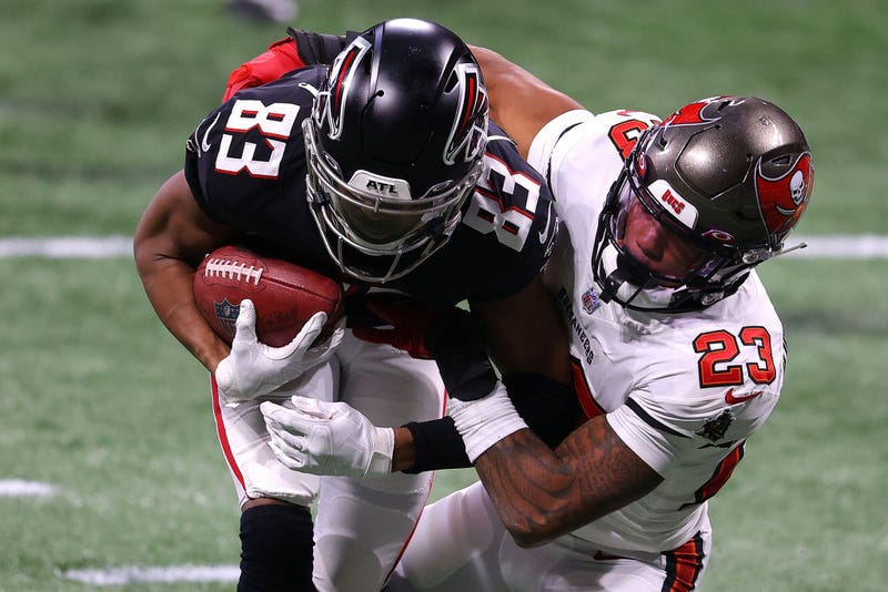 Russell Gage attempts to shrug off a tackle against the Buccaneers.