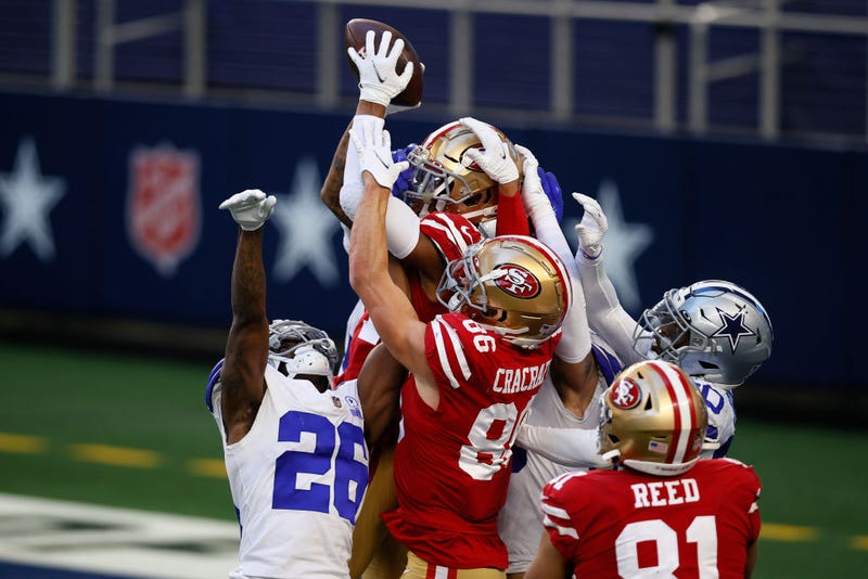 Wide receiver Kendrick Bourne #84 of the San Francisco 49ers pulls in a hail Mary touchdown pass at the end of the game against cornerback Jourdan Lewis #26 of the Dallas Cowboys at AT&T Stadium on December 20, 2020 in Arlington, Texas.