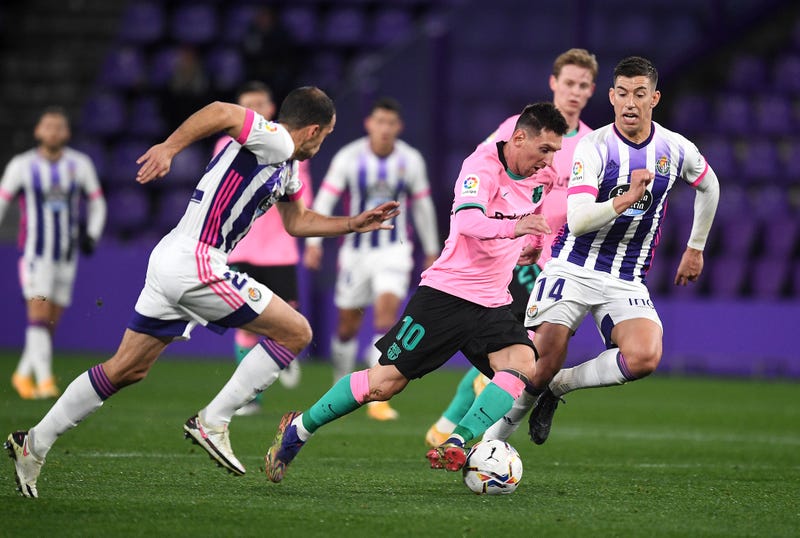 Lionel Messi of Barcelona breaks away from Ruben Alcaraz of Valladolid during the La Liga Santander match between Real Valladolid CF and FC Barcelona at Estadio Municipal Jose Zorrilla on December 22, 2020 in Valladolid, Spain. 