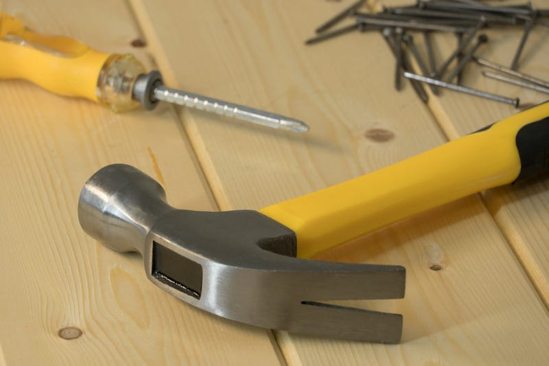Hammer, nails, screwdriver and wood