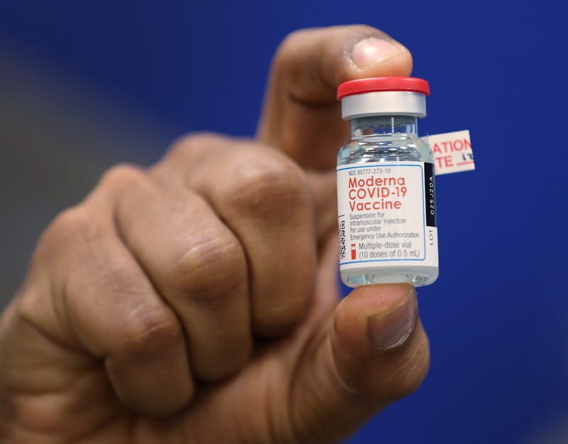 Dave Lacknauth, Pharm. D., Director of Pharmacy Services, Broward Health Medical Center shows off a bottle of the Moderna COVID-19 vaccine during a press conference on December 23, 2020 in Fort Lauderdale, Florida.