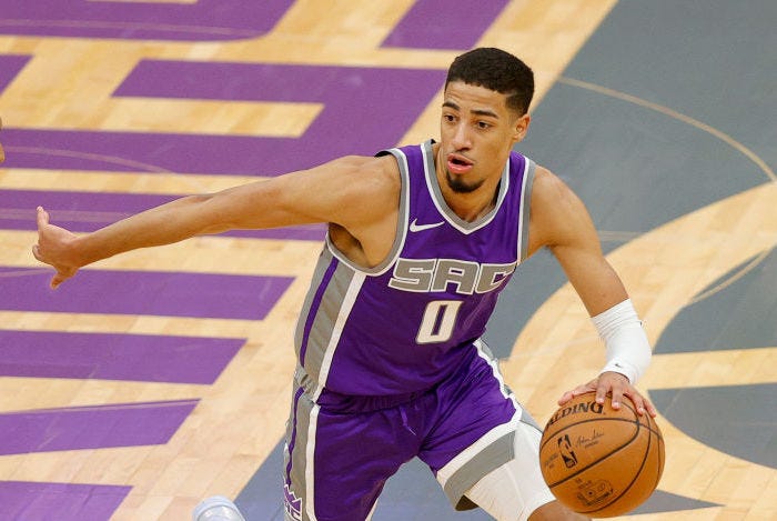 Tyrese Haliburton dribbles toward the basket.