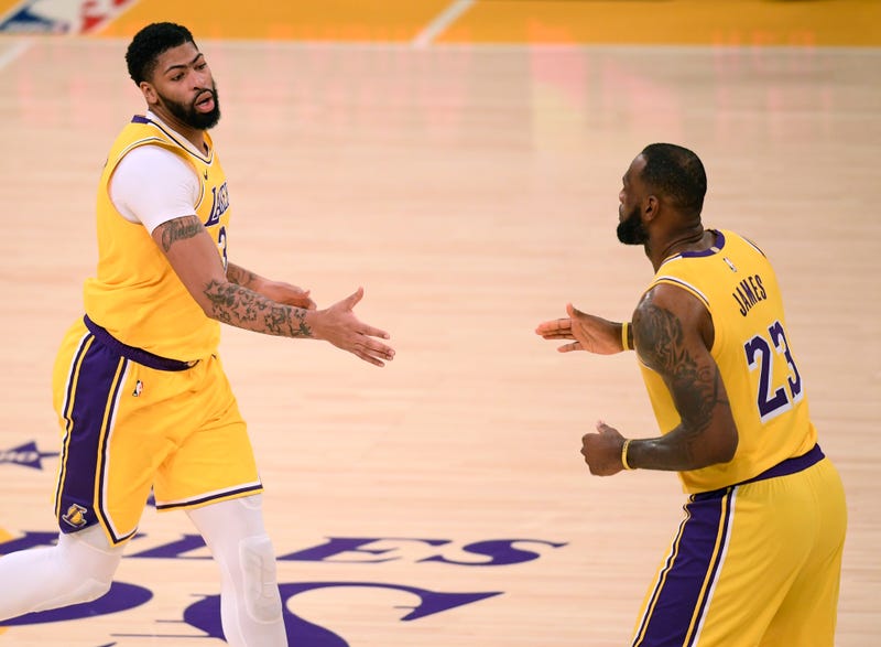 Lakers stars LeBron James and Anthony Davis celebrate a basket.