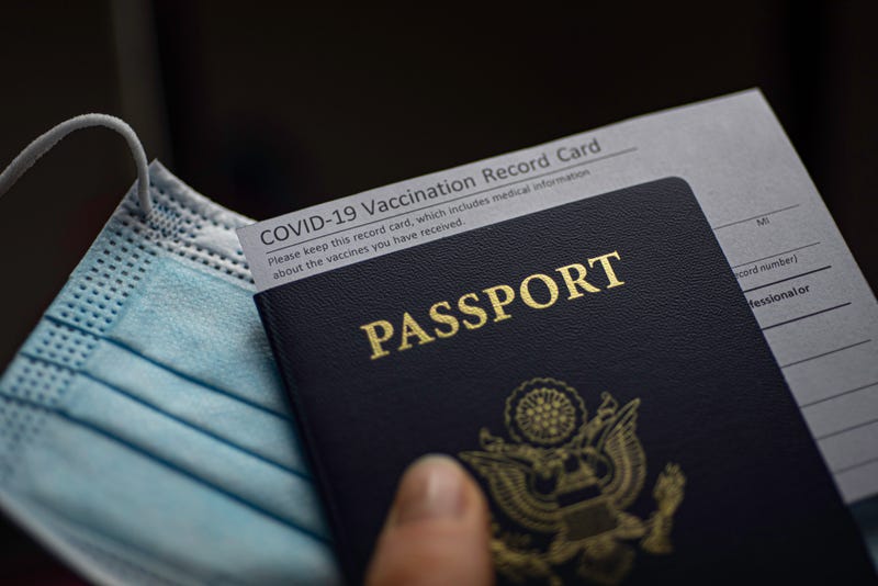 COVID-19 vaccination record card and passport.