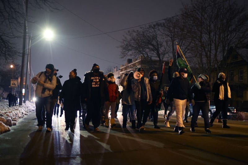 Demonstrators march through town to protest Kenosha County District Attorney Michael Graveley's announcement that no charges would be filed against Police Officer Rusten Sheskey in the shooting of Jacob Blake on January 05, 2021.