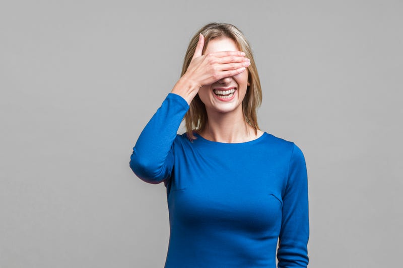 Woman covering face