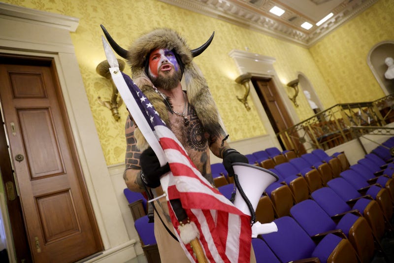 A protester yells inside the Senate Chamber on January 06, 2021 in Washington, DC. Congress held a joint session today to ratify President-elect Joe Biden's 306-232 Electoral College win over President Donald Trump. Pro-Trump protesters entered the U.S. Capitol building during mass demonstrations in the nation's capital.